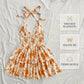 👗🌸 LIMITED-TIME 60% OFF! Women’s Halter Tie-Neck Printed Mini Dress – Lace-Up Front, Smocked Back & Tiered Ruffle Skirt ✨
